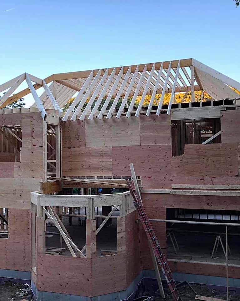 Roof trusses set on a framed single-family house