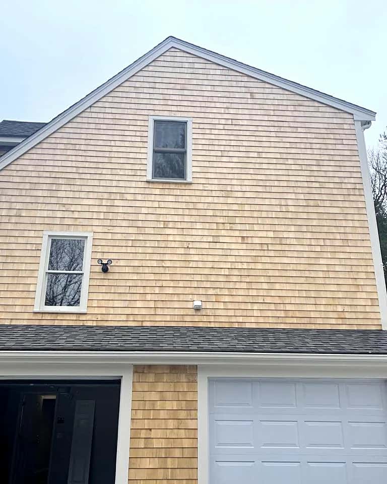 Cedar-shingle gable over a two-car garage