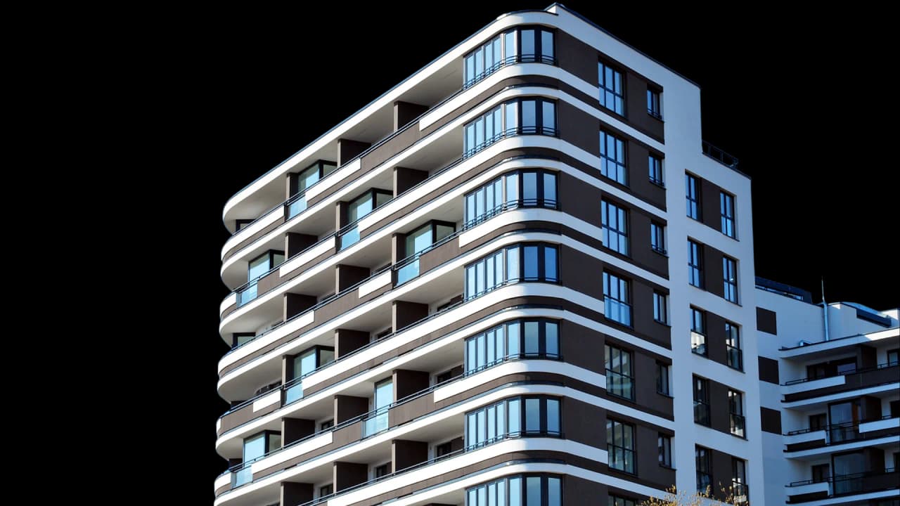Modern multifamily residential building with curved balconies